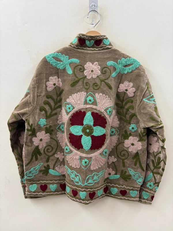 Embroidered sweater with floral patterns on a white background