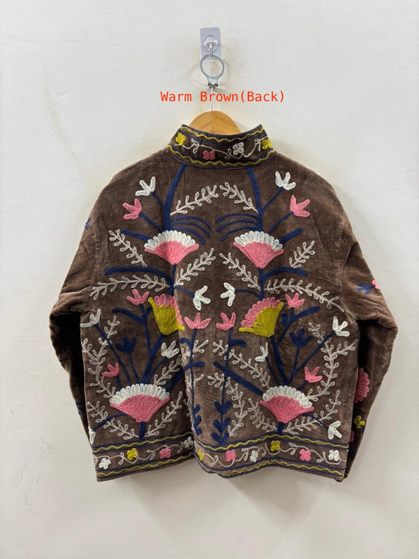 Brown embroidered jacket with colorful patterns on a white background
