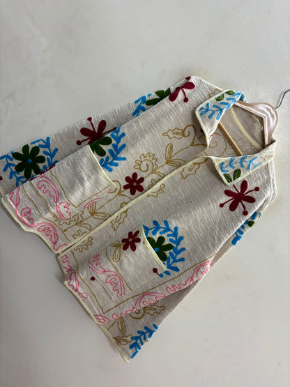 The Baghicha Bloom — Suzani Hand-Embroidered Cotton Jacket — Ivory with Cranberry, Sage & Sky Blue