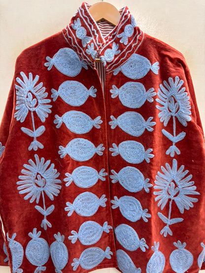 The Anar Bagh — Suzani Hand-Embroidered Velvet Cape Jacket — Rust Red with Powder Blue Motifs
